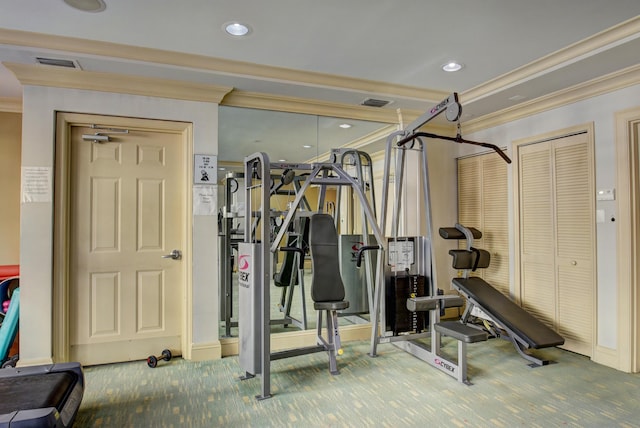 exercise area featuring crown molding and carpet