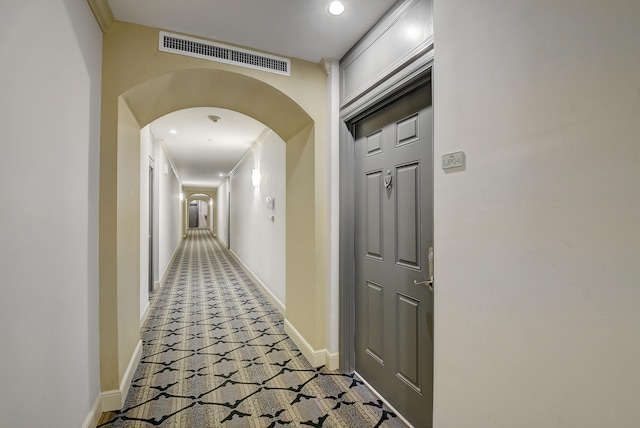 corridor featuring crown molding