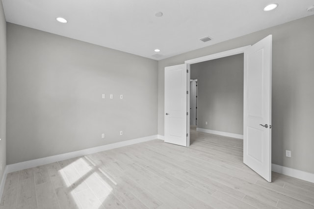 unfurnished bedroom with light hardwood / wood-style floors