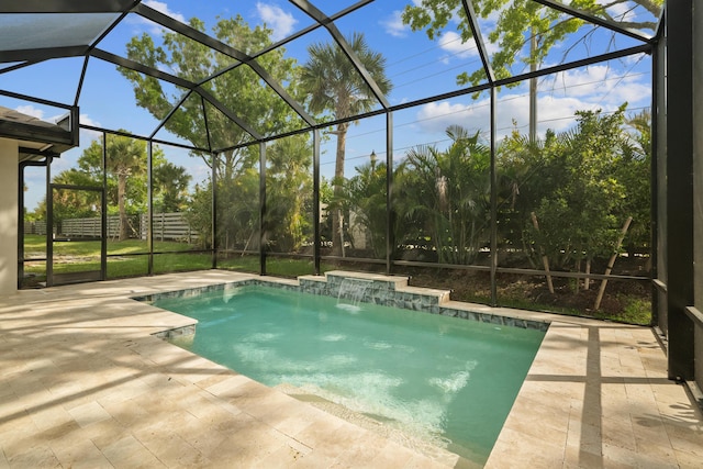 view of swimming pool featuring a lanai, pool water feature, and a patio area