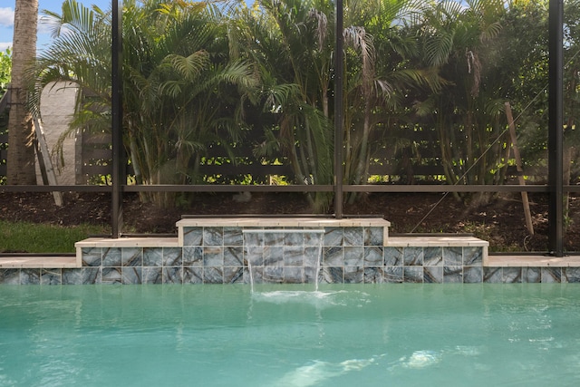 view of pool with pool water feature