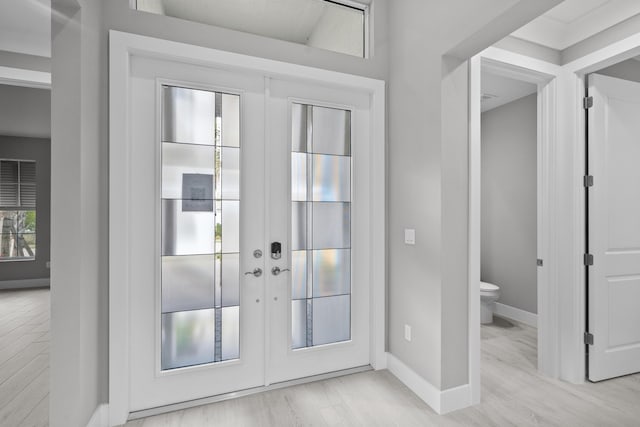 doorway featuring light hardwood / wood-style flooring and french doors