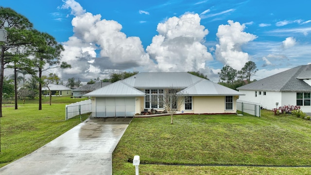 view of front of home with a garage and a front yard