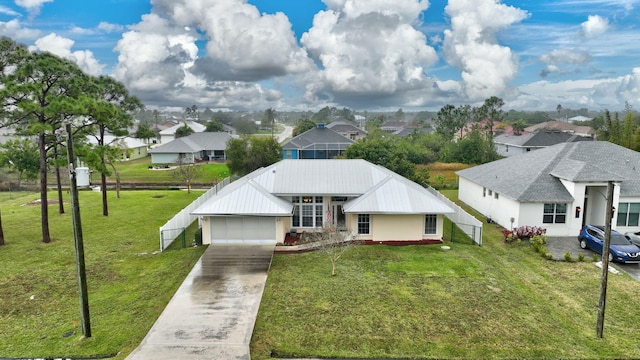 view of front of property featuring a garage and a front yard