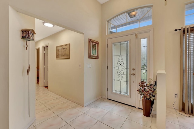 tiled foyer featuring a wealth of natural light