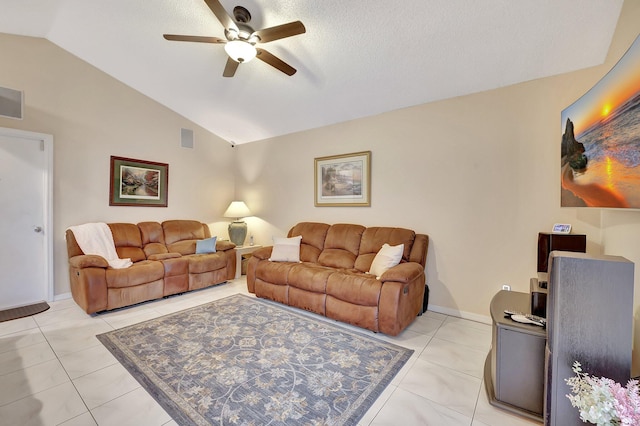 tiled living room with ceiling fan and vaulted ceiling