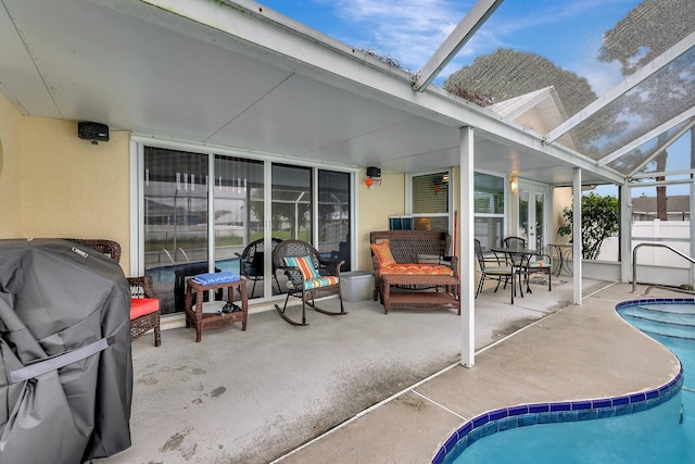 view of pool with a patio and a lanai