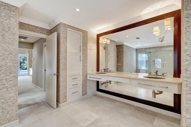 bathroom featuring ornamental molding and vanity