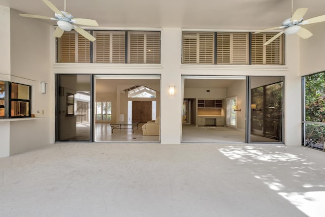 interior space featuring ceiling fan and a patio area