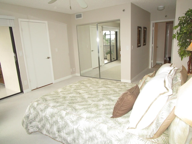 bedroom with light carpet and ceiling fan