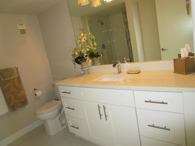 bathroom with vanity, toilet, tile patterned flooring, and a shower