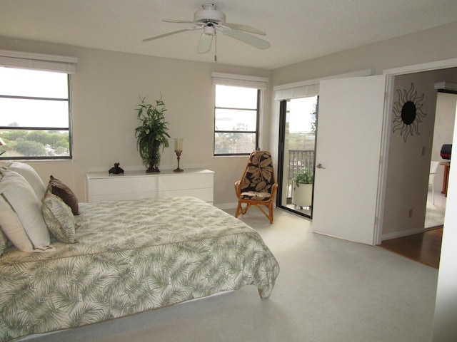 bedroom featuring ceiling fan and access to exterior