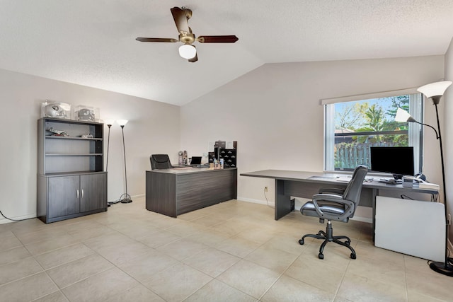 home office with baseboards, lofted ceiling, light tile patterned flooring, a textured ceiling, and a ceiling fan