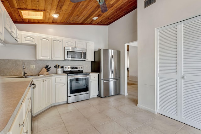 kitchen featuring visible vents, a sink, light countertops, appliances with stainless steel finishes, and wooden ceiling