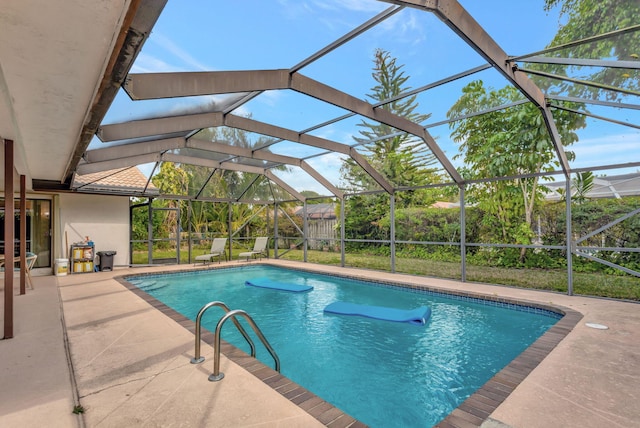 pool featuring a lanai and a patio area