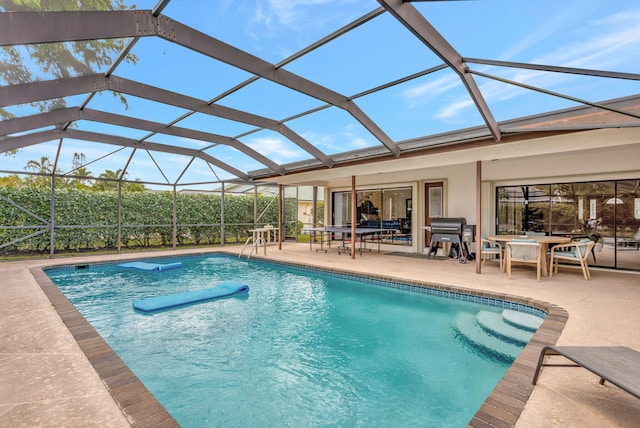 outdoor pool featuring glass enclosure, area for grilling, outdoor dining space, and a patio area