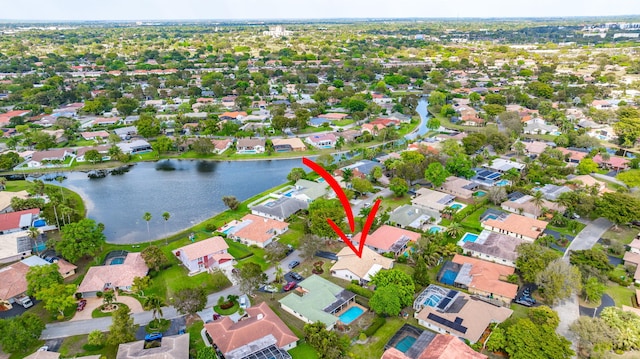 birds eye view of property featuring a residential view and a water view