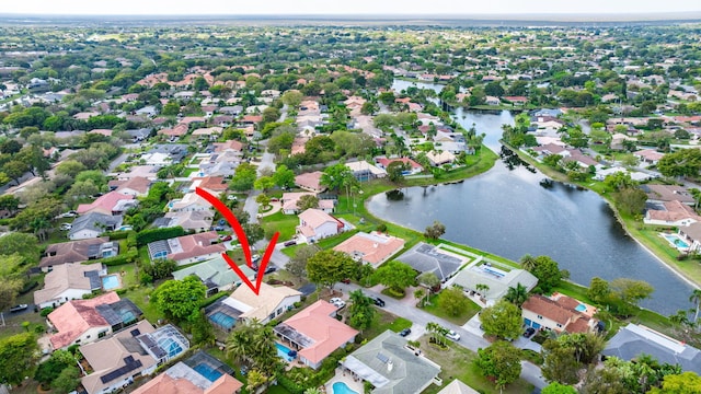 bird's eye view featuring a residential view and a water view