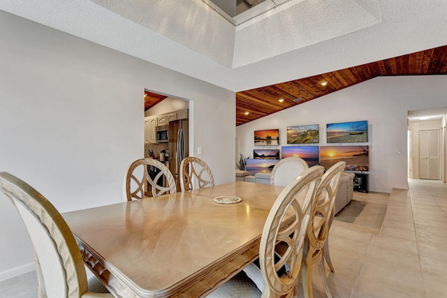 dining space featuring light tile patterned flooring, a textured ceiling, wood ceiling, and lofted ceiling