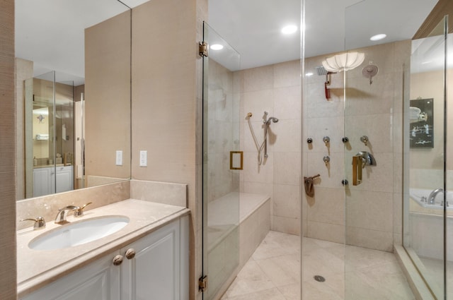 bathroom featuring vanity and an enclosed shower