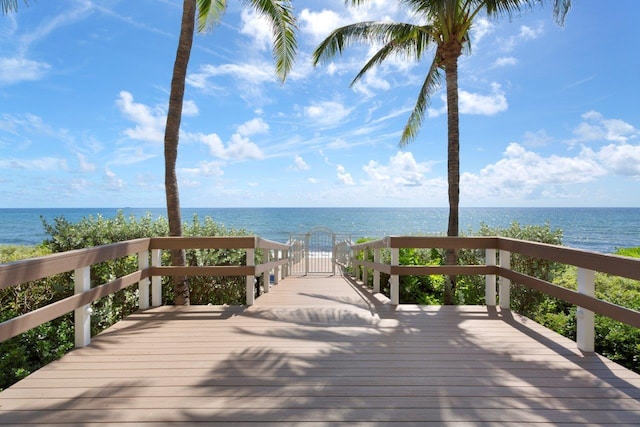 wooden deck with a water view