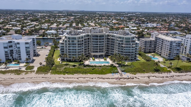 bird's eye view with a water view and a view of the beach