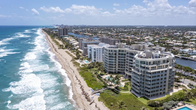 aerial view featuring a water view and a beach view