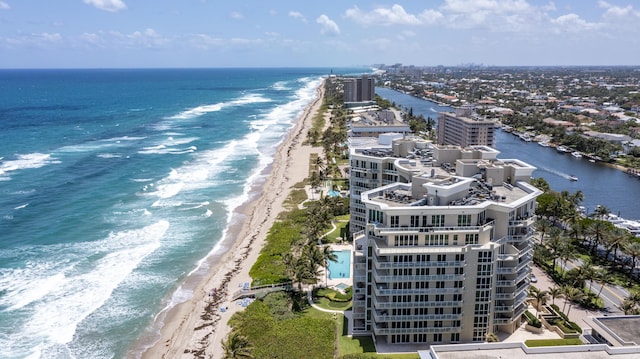 aerial view with a water view and a view of the beach