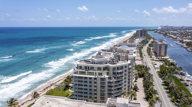 aerial view with a water view and a view of the beach