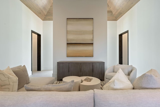 living room with high vaulted ceiling and wood ceiling