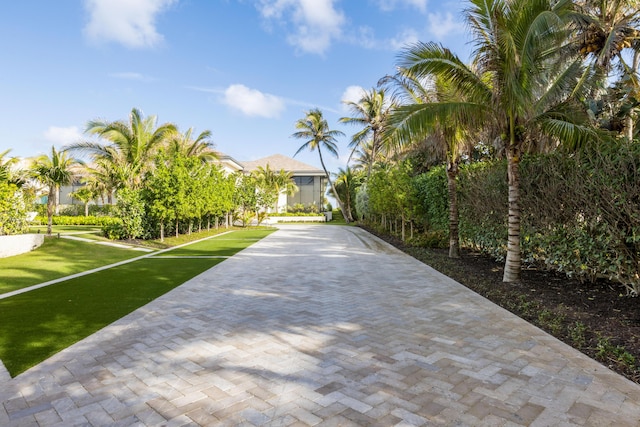 1160 S Ocean Blvd, Manalapan, FL 33462 - view of front of home featuring a front yard and decorative driveway