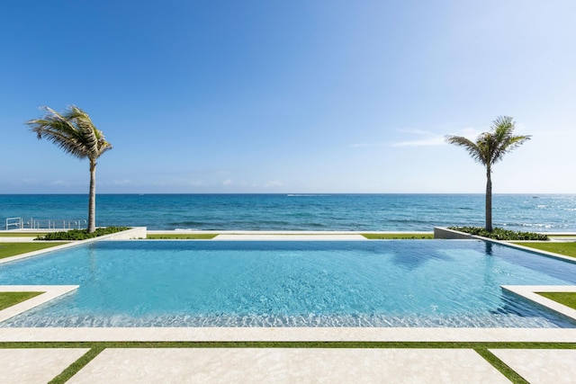 view of pool featuring a water view