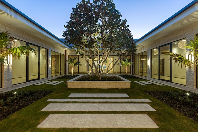 1160 S Ocean Blvd, Manalapan, FL 33462 - view of grassy yard with a sunroom