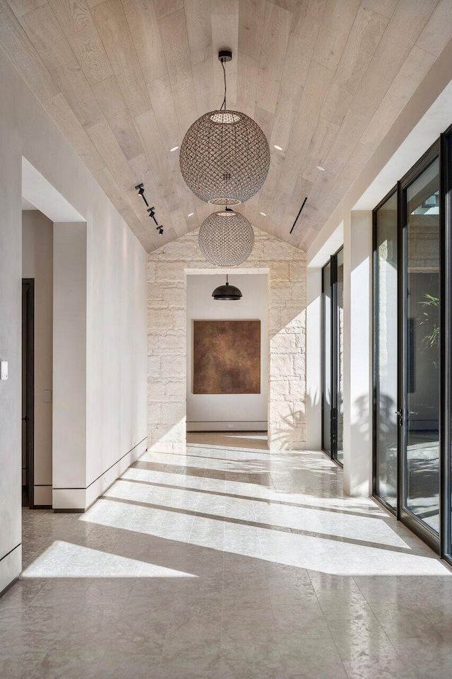 hallway featuring lofted ceiling and wooden ceiling