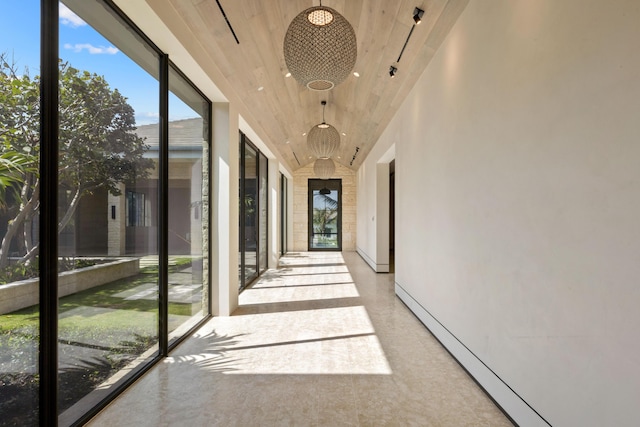 hallway with wood ceiling and a baseboard radiator