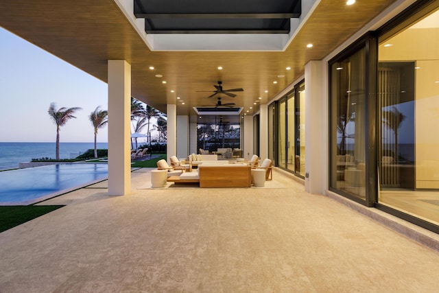 1160 S Ocean Blvd, Manalapan, FL 33462 - view of patio featuring outdoor lounge area, ceiling fan, and a water view