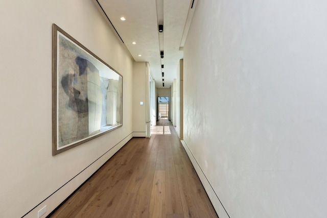 1160 S Ocean Blvd, Manalapan, FL 33462 - hall featuring wood finished floors, a baseboard heating unit, recessed lighting, and baseboard heating