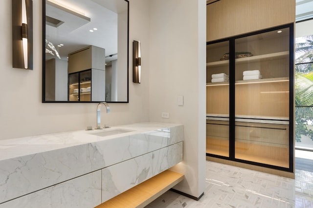 bathroom featuring a wealth of natural light and vanity