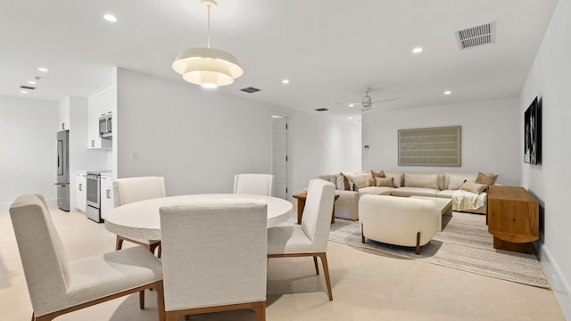 dining space featuring ceiling fan