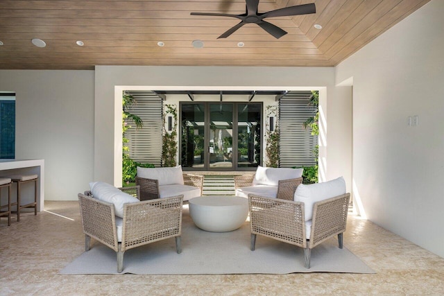 view of patio featuring an outdoor living space, french doors, and ceiling fan