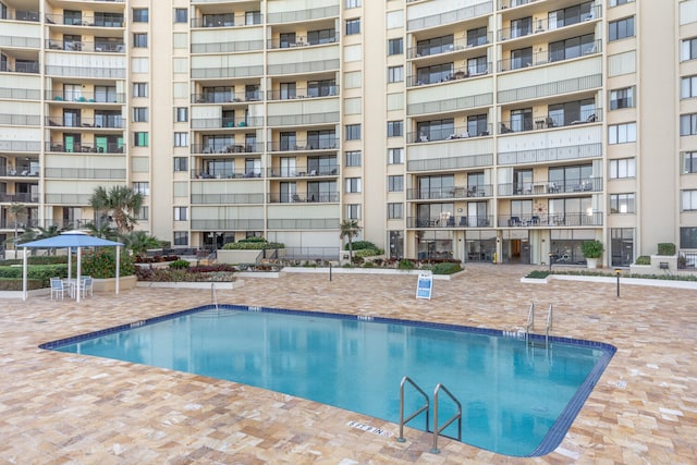 view of pool featuring a patio