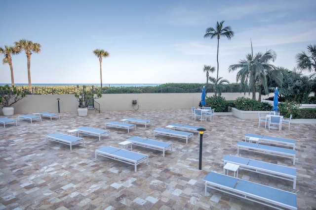 view of patio featuring a water view