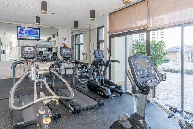 exercise room featuring a textured ceiling