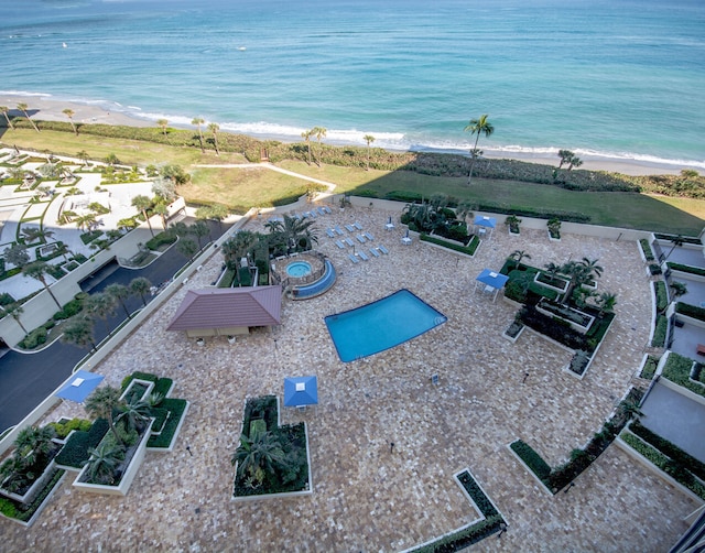 bird's eye view with a water view and a view of the beach