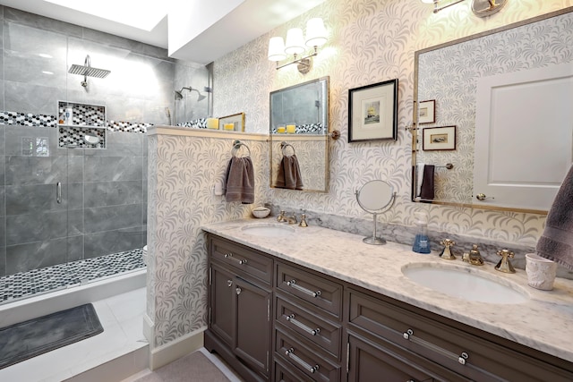 bathroom with a shower with door and vanity