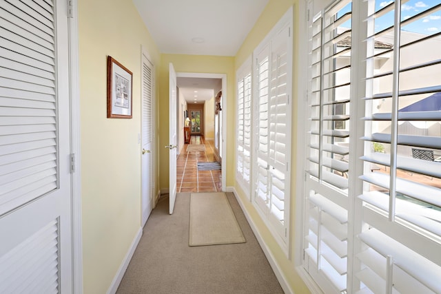 hallway with light carpet