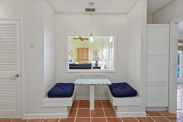 hall with tile patterned flooring