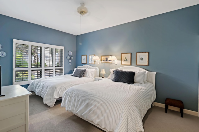 bedroom with ceiling fan and light colored carpet