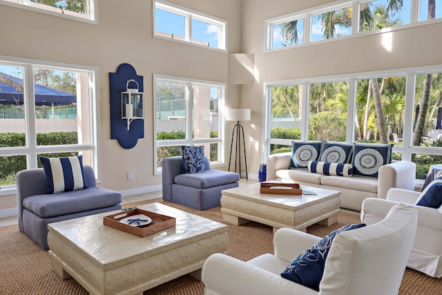 living room with a towering ceiling