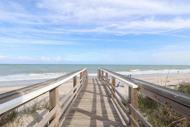 view of community featuring a water view and a view of the beach